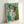 Framed poster showing a figure at a basin in soft watercolor hues, exemplifying classic Impressionist portraiture with gentle color harmonies.