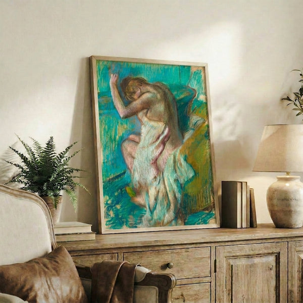 Classic Impressionist composition of a woman bathing, rendered in soft pastels with an intimate, peaceful atmosphere, displayed as a framed print.