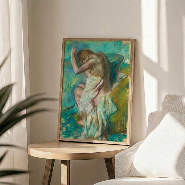 Vintage-inspired art print in muted blues and warm neutrals depicting a bathing scene with characteristic Impressionist delicacy and light.
