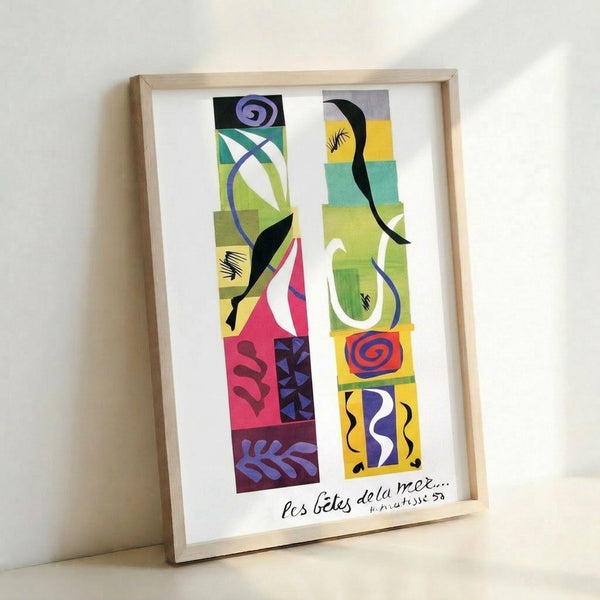 Vibrant wall poster displaying organic sea creature silhouettes in brilliant blues, greens, and warm accents, characteristic of mid-century modernist paper cut aesthetics.