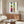Minimalist interpretation of marine life as geometric and organic shapes in striking blues, greens, reds, and yellows, evoking joyful mid-century modernism.