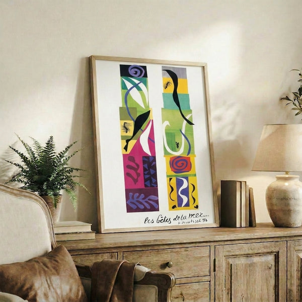 Modern framed print displaying vibrant biomorphic shapes in rich hues creating a whimsical marine-inspired design.