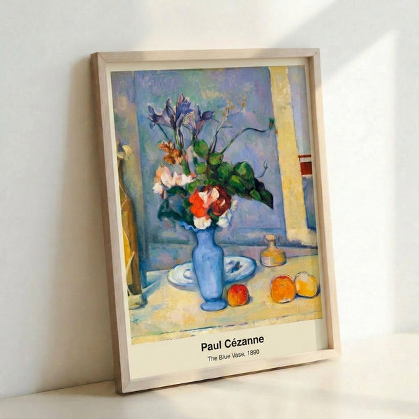 Minimalist poster artwork showcasing balanced arrangement of apples and a blue vase in impressionist palette of ochre, green, and white, evoking quiet contemplation.
