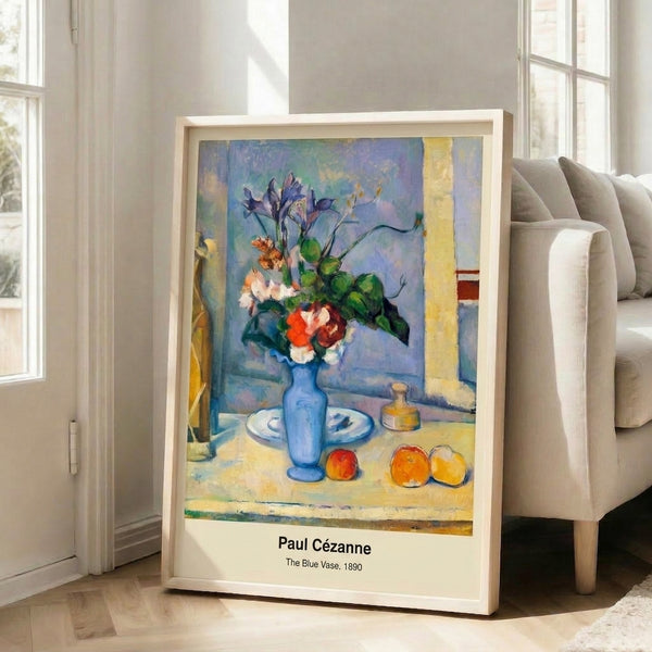 Wall art print in impressionist style depicting a blue vase as focal point amid scattered red apples and fruit on a table, rendered with nuanced balance of cool and warm hues.