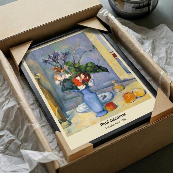 Contemplative framed artwork of a blue vase surrounded by apples and table drapery, executed in sophisticated impressionist style with ochre, green, red, and white tones.