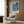 Minimalist wall art print with a reflective blue window composition using cool and warm tones in abstract geometric arrangement on white ground.