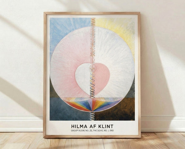Abstract geometric framed poster featuring a pale pink circle with concentric spirals and heart form, soft blue and cream accents, and earthy tones in a Bauhaus minimalist style.
