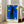 Framed contemporary print of a falling figure in abstract form against an indigo night sky, using bold strokes of black, crimson red, and golden yellow in modernist design.