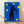Abstract modernist poster of The Fall of Icarus, 1943, featuring bold geometric shapes in blue, yellow, and black on a vibrant background, framed on a wall.