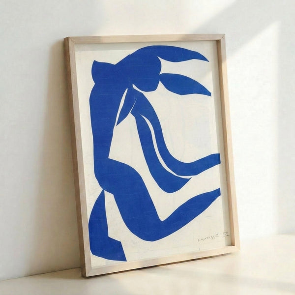 Framed wall art showcasing undulating silhouettes in a minimalist composition with warm neutrals and soft hues, capturing the essence of mid-century artistic experimentation.