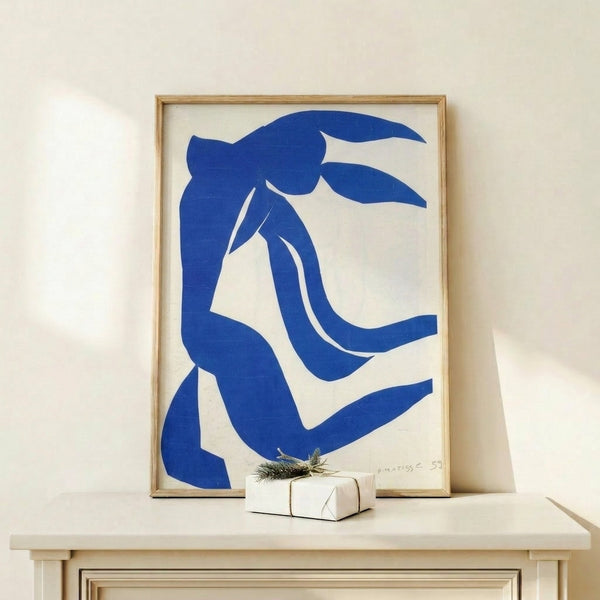 Contemporary art print with organic, flowing shapes in peachy tones and soft greens, executed in the elegant cut-out style characteristic of modernist masters.