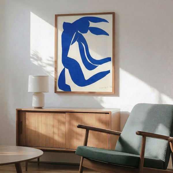 Wall art print with lyrical abstract shapes in soft ochre, rose, and sage tones, showcasing the bold simplicity of cut-paper modernist composition.