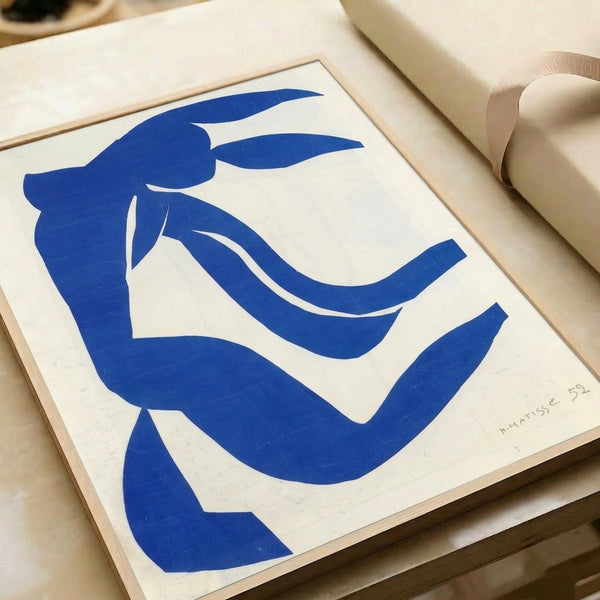 Poster displaying fluid, organic silhouettes in a serene palette of warm creams and soft earth tones, embodying the elegance of twentieth-century abstract art.