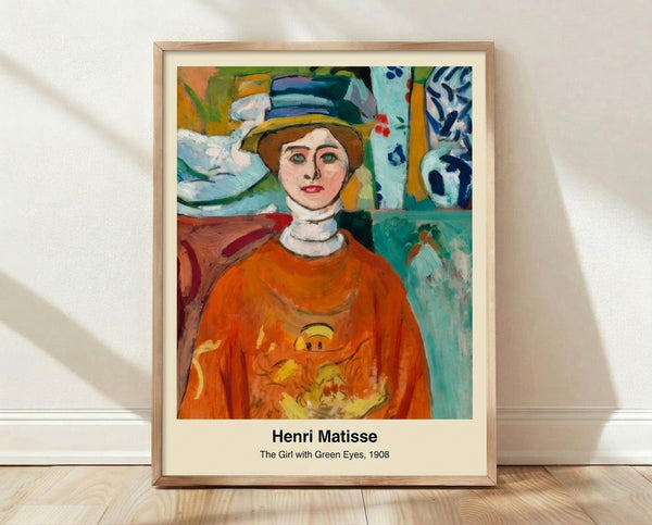 Modernist portrait of a woman with striking green eyes against soft blue and ochre tones, capturing a contemplative and elegant mood in this framed art print.