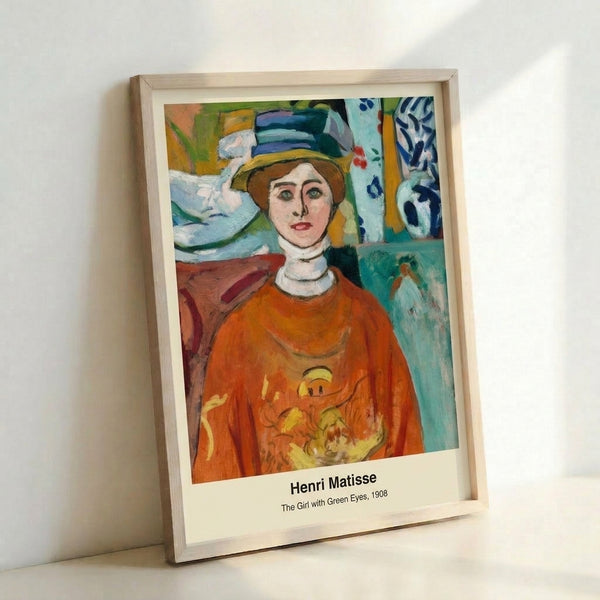 Woman's face rendered in modernist style with luminous green eyes, soft blue hues, and ochre details, evoking contemplative intimacy as a framed poster.