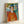 Wall art print depicting a girl with intense green gaze and simplified facial features in warm peachy and ochre hues, exemplifying early 20th-century modernist portraiture.