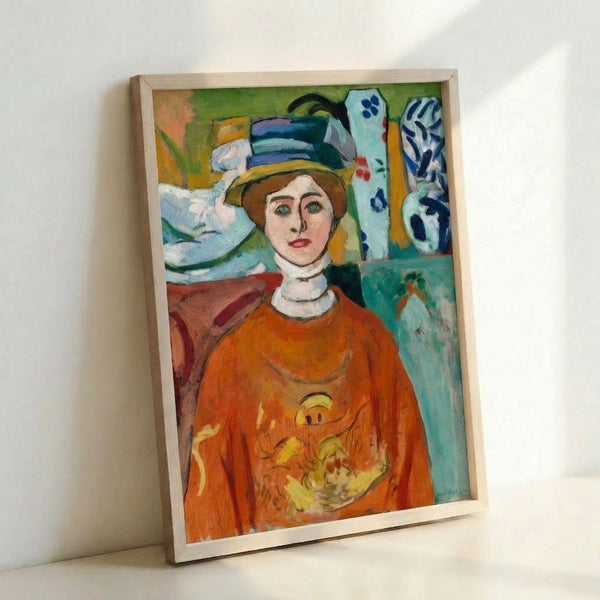 Wall art print depicting a girl with intense green gaze and simplified facial features in warm peachy and ochre hues, exemplifying early 20th-century modernist portraiture.