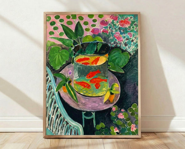 Framed Matisse goldfish print featuring a vibrant red fish swimming among aquatic plants in warm orange and green tones, displayed as wall art.