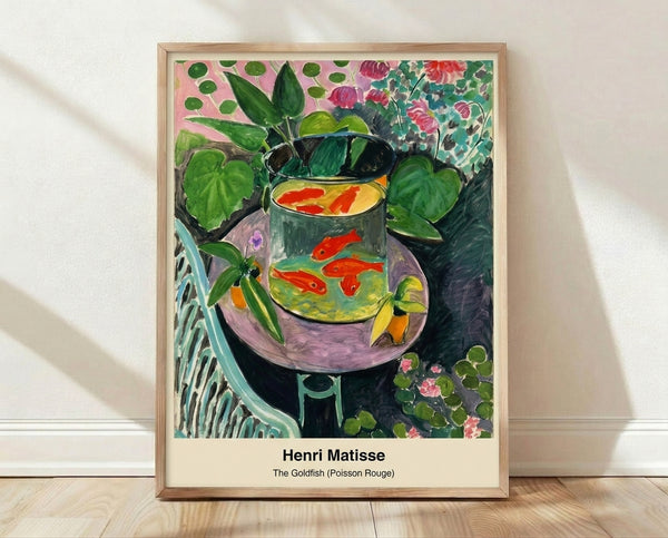 Framed modern art print featuring a coral goldfish swimming in a blue bowl beside a green potted plant, rendered in soft ochre and white tones with a tranquil, contemplative mood.