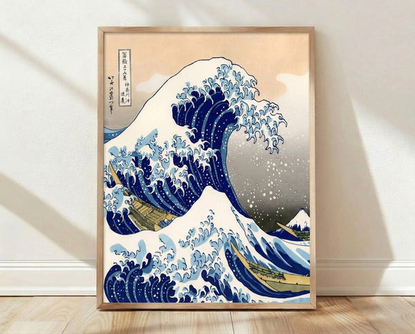 Hokusai's iconic woodblock print of a towering indigo wave with a distant snow-capped mountain, framed as a vintage wall poster.