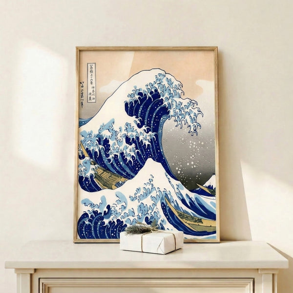 Dynamic vintage Japanese woodblock print of a crashing wave in rich blues with delicate gold accents and a distant snowy peak, wall art for classic interiors.