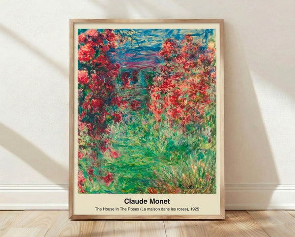 Impressionist framed art print of a house nestled among blooming roses and garden flowers in soft pink, green, and golden tones, creating a luminous romantic atmosphere.