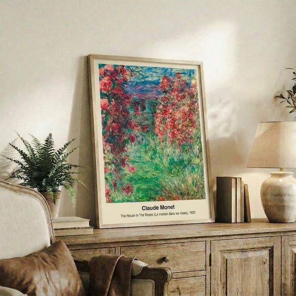 Abstract floral wall poster of a house surrounded by roses and garden flowers rendered in soft impressionist colors of blush pink, sage green, and cream.