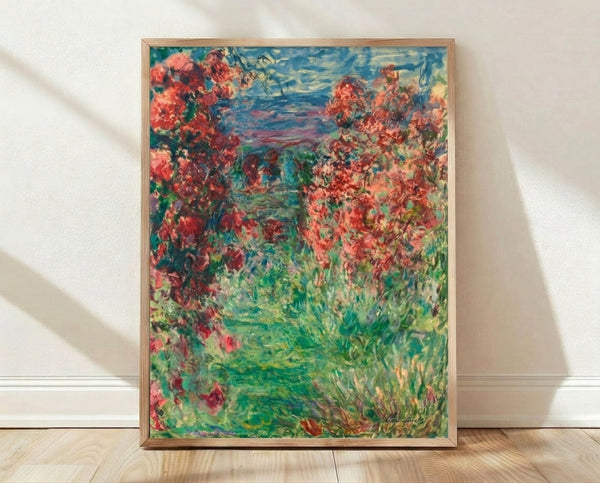 Framed art print of The House In The Roses, a Monet masterpiece featuring a charming cottage nestled within a lush garden of blooming roses in soft impressionist brushstrokes.