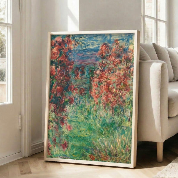 Framed poster of The House In The Roses by Monet, an elegant impressionist painting of a peaceful home surrounded by abundant flowering roses in soft, atmospheric colors.