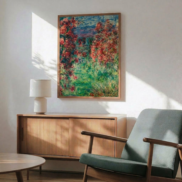 Wall-mounted art print capturing Monet's The House In The Roses, a tranquil impressionist composition of delicate blooms and architectural charm in gentle pinks, whites, and greens.