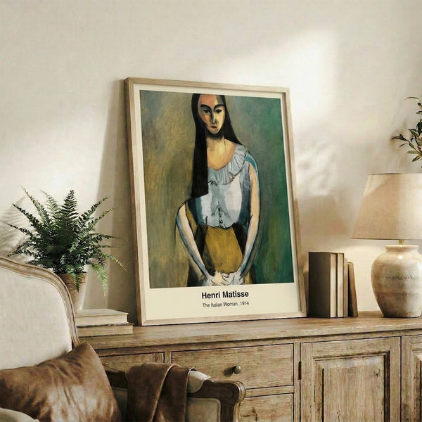 Framed art print of an abstracted female portrait in gray and earth tones, rendered in a stark, iconic minimalist manner characteristic of modernist portraiture.