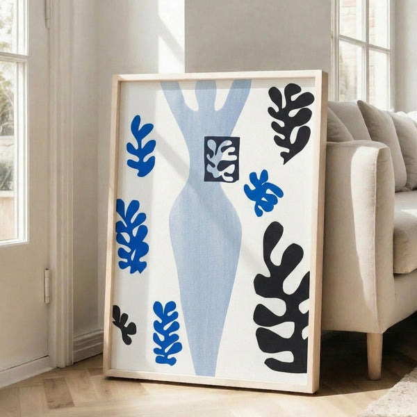 Framed abstract poster with interlocking paper-cut style shapes in muted earth tones and neutral hues, exemplifying modernist printmaking on a gallery wall.