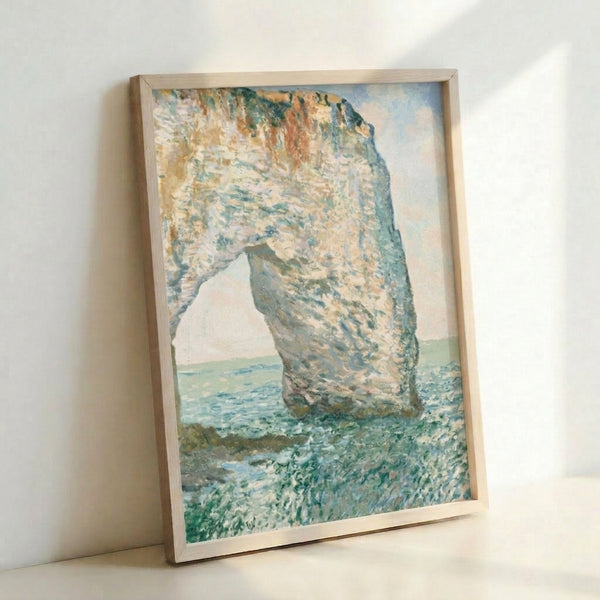 Framed art print of the iconic Manneporte cliff formation in Normandy, rendered in soft impressionist style with atmospheric lighting.