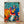 Abstract modern poster featuring colorful figures in a rhythmic composition, celebrating the joy and movement of music through bold simplified forms and a vibrant palette of blues, reds, and earth tones.