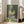 Soft-toned Impressionist scene of Parc Monceau with atmospheric depth in cool blues and warm earth colors, presented as a vintage-style framed artwork.