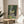 Peaceful park composition in delicate blues and greens capturing natural light and movement through Monet's signature Impressionist brushstrokes, framed on wall.