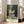 Monet's 1876 masterpiece showing a peaceful park scene with dappled shade and glowing light, rendered in muted greens and blues as a framed wall art print.