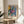 Modern abstract poster of pink and blue peonies with flowing green elements, expressive yet serene in style and mood.