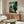 Expressionist framed poster featuring a solitary figure rendered in soft earthtones and pale hues, communicating melancholy and introspective mood through loose brushwork.