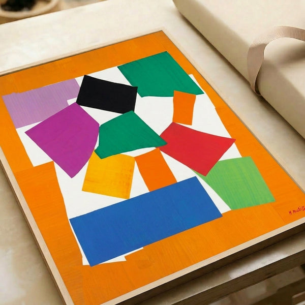 Vibrant modern art print with overlapping geometric shapes in jewel tones and warm hues forming a whimsical snail design, displayed as a framed poster.
