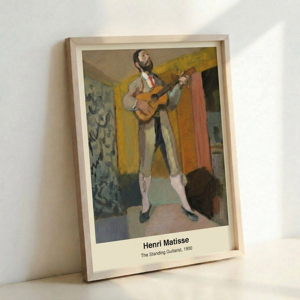 Abstract figure of a guitarist in minimalist line art, dominated by ochre and blue tones against cream background; framed wall art.