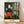 Matisse Impressionist painting of an artist's studio overlooking Quai St Michel, featuring an easel, canvas, and model in ochre, blue, and earth tones, framed as a wall poster.