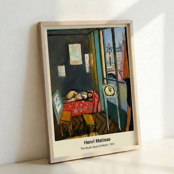 Framed poster of a studio interior with artist, model, and easel near a window with river vista, composed in muted earth tones and blues with Art Nouveau sensibility.