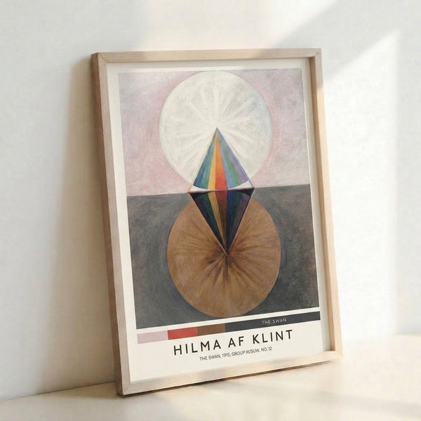 Minimalist abstract artwork with meditative geometric shapes including circular patterns and conical forms rendered in muted earth tones and blue, displayed as framed wall art.