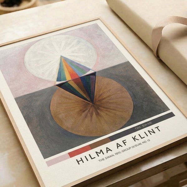 Modernist abstract wall art with meditative geometric elements—circles, spirals, and cones—rendered in soft cream, pink, brown, and navy tones on a neutral ground.