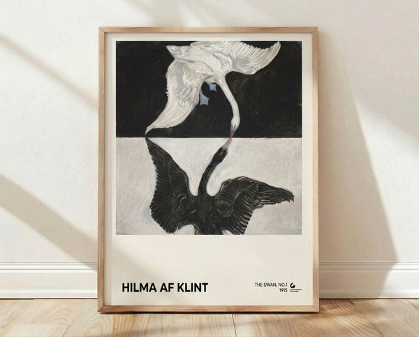 Framed art print of Hilma af Klint's The Swan No.1, featuring a minimalist white swan in elegant Art Nouveau style with soft blue and gold accents against a cream background.