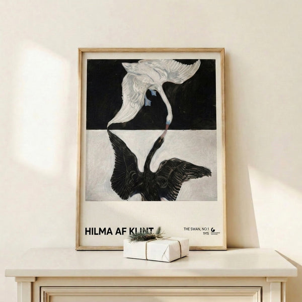 Wall art print of The Swan No.1, a symbolic bird study by Hilma af Klint rendered in soft whites and blacks with delicate blue and gold details in Art Nouveau style.