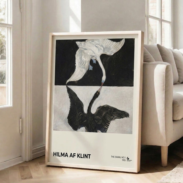 Minimalist framed art featuring Hilma af Klint's celebrated swan composition, combining white and black tones with hints of blue and gold in a serene, sophisticated aesthetic.