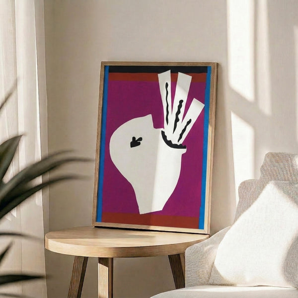 Framed art print with a whimsical sword swallower rendered in abstract paper-cut style using bright, contrasting colors and geometric composition.