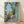 Framed poster of Henri Matisse's The Terrace St Tropez, featuring bright abstracted Mediterranean landscape with bold geometric shapes in vibrant blues, greens, and warm yellows.
